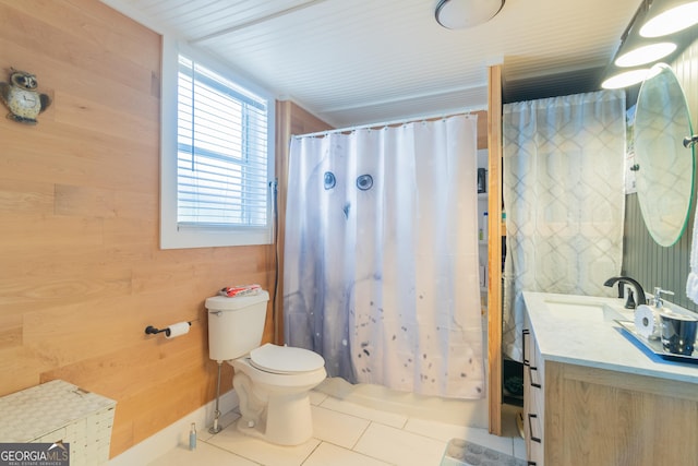 full bathroom with vanity, wooden walls, shower / bathtub combination with curtain, tile patterned flooring, and toilet