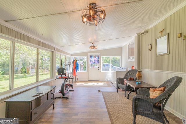 sunroom / solarium featuring vaulted ceiling