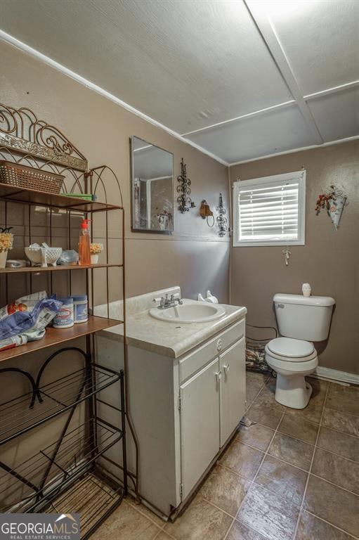 bathroom with vanity and toilet