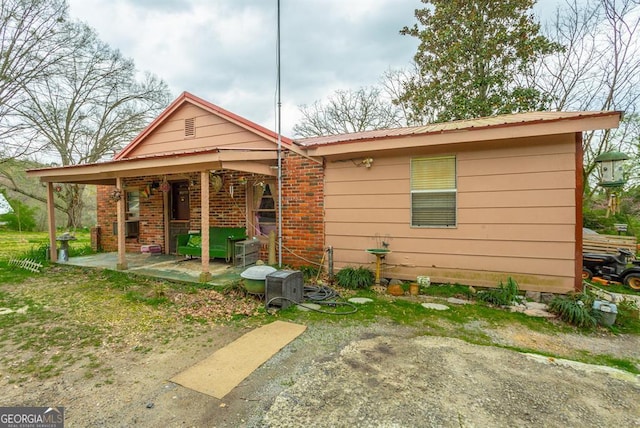 back of house with a patio area