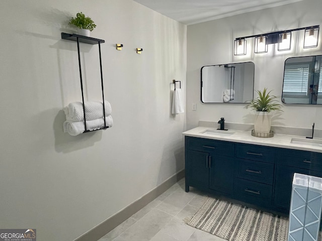 bathroom with tile patterned floors and vanity