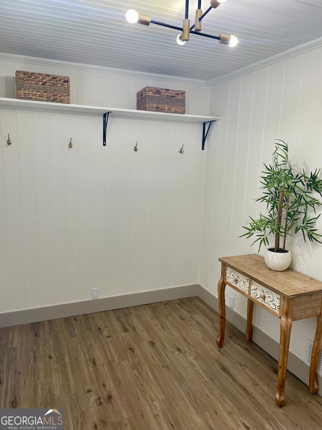 mudroom with hardwood / wood-style floors and crown molding