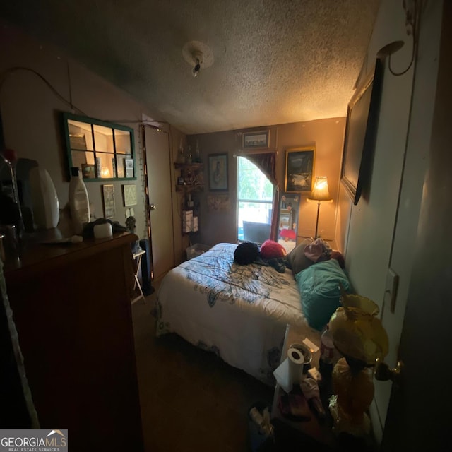 bedroom featuring a textured ceiling