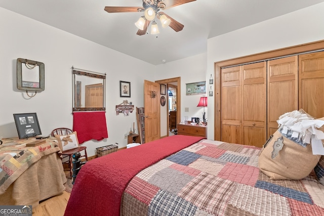 bedroom featuring light wood-type flooring, a closet, and a ceiling fan