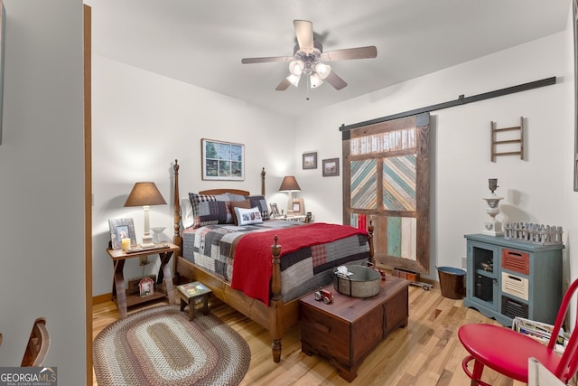 bedroom with light wood-style floors and ceiling fan