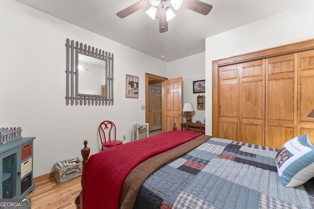 bedroom with light wood-type flooring, baseboards, a closet, and ceiling fan