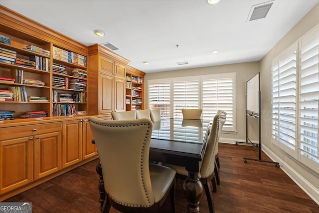 dining area featuring dark hardwood / wood-style floors