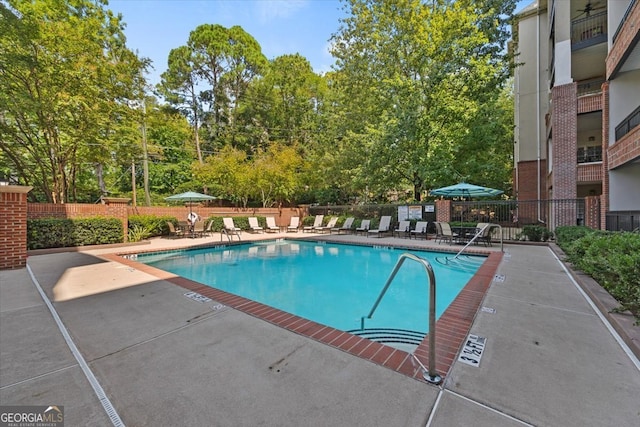 view of swimming pool featuring a patio