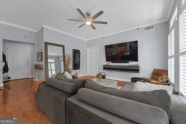 living room with crown molding, ceiling fan, and hardwood / wood-style flooring