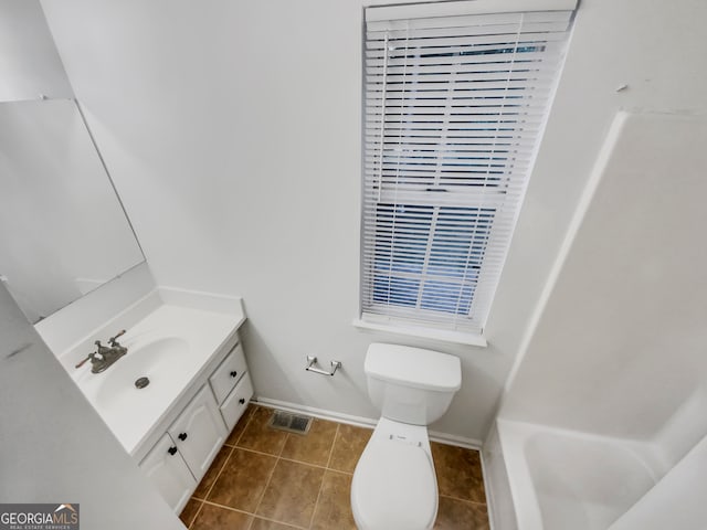 full bathroom featuring independent shower and bath, vanity, toilet, and tile patterned floors