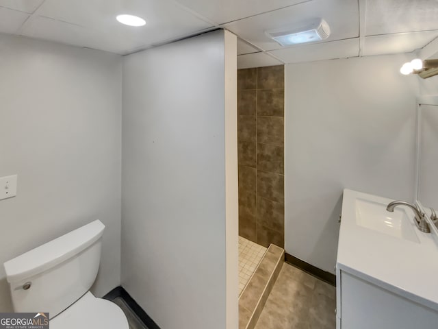 bathroom featuring walk in shower, vanity, and toilet