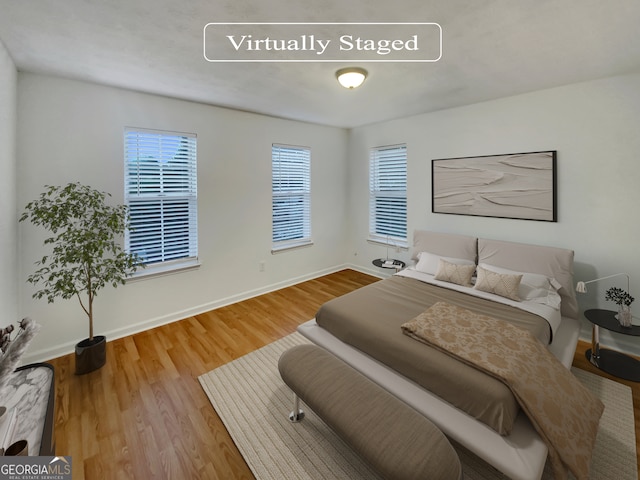 bedroom featuring hardwood / wood-style floors