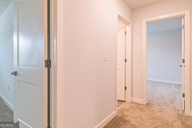 hallway with light carpet