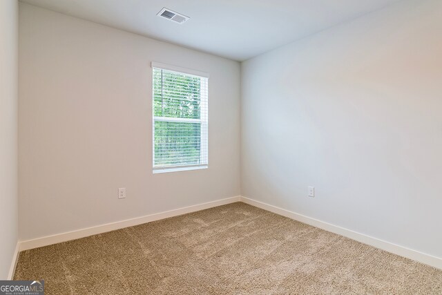 unfurnished room with carpet floors