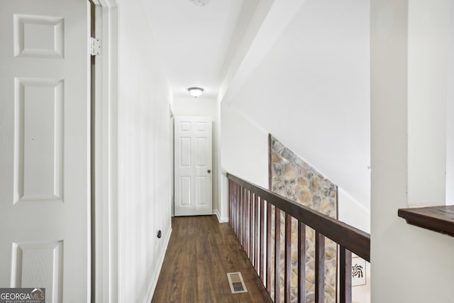 corridor with dark hardwood / wood-style floors