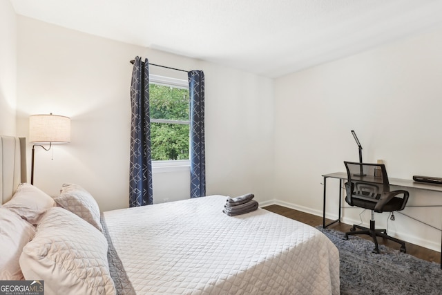 bedroom featuring dark hardwood / wood-style flooring