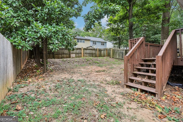 view of yard featuring a wooden deck