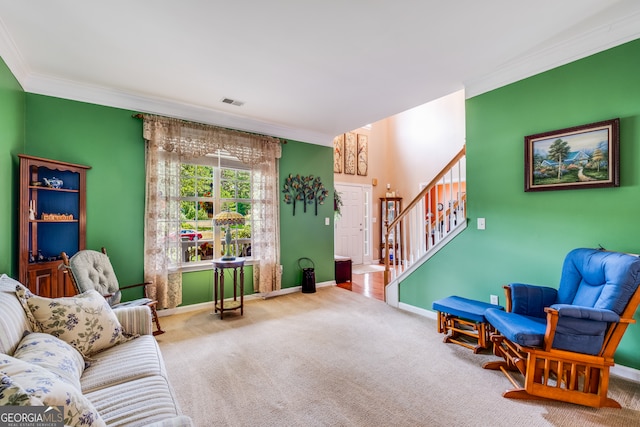 living area featuring crown molding and carpet flooring