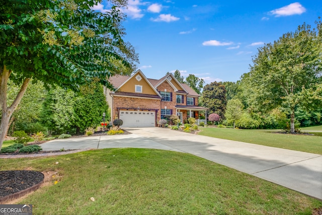 view of front of home featuring a garage and a front lawn