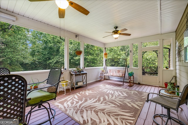 sunroom / solarium featuring ceiling fan