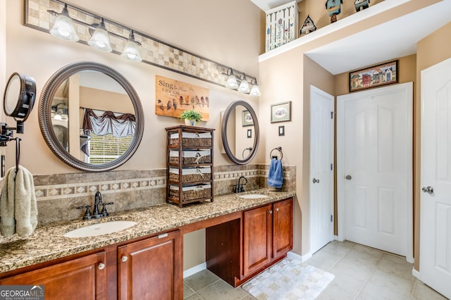 full bathroom featuring double vanity, decorative backsplash, a sink, and tile patterned flooring