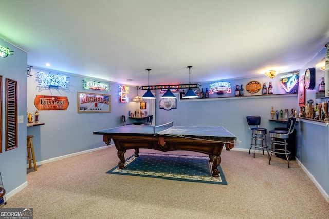 game room with a bar, baseboards, carpet, and pool table