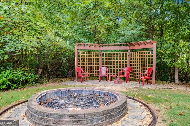 view of yard with a fire pit