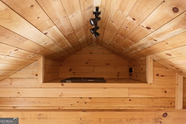 additional living space featuring wood walls, wood ceiling, and vaulted ceiling