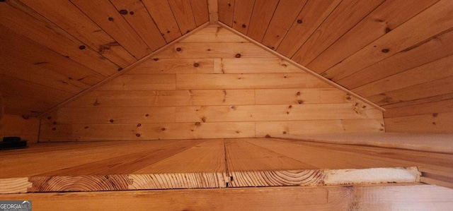 bonus room with wooden ceiling