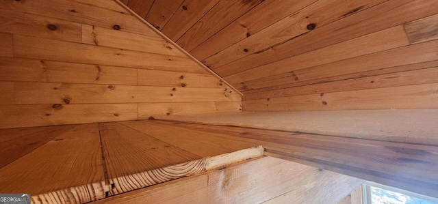 view of sauna / steam room with wood ceiling and wooden walls