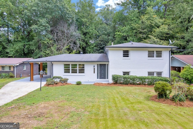 tri-level home with a front yard