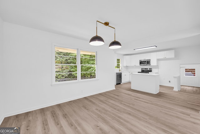 unfurnished living room with light wood-type flooring