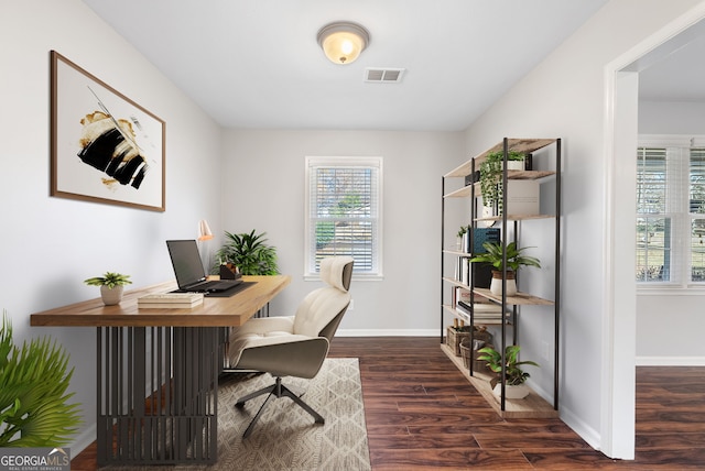 home office with dark wood-type flooring