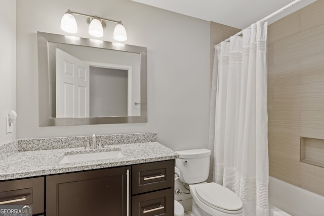 full bathroom featuring vanity, shower / bath combo, and toilet