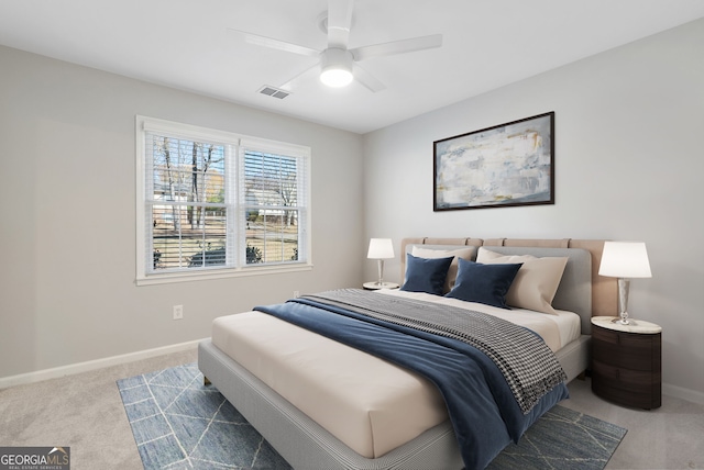 carpeted bedroom with ceiling fan