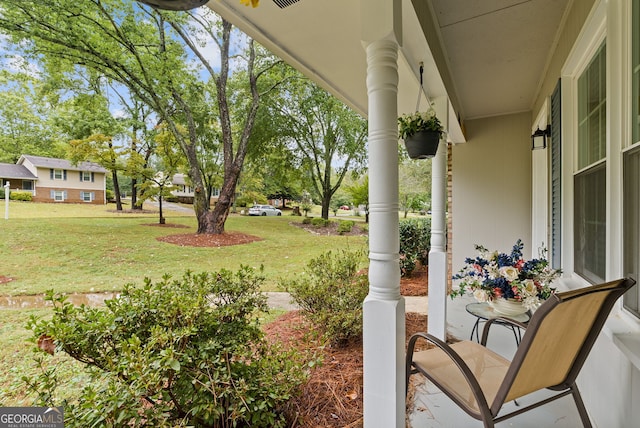 view of yard with covered porch