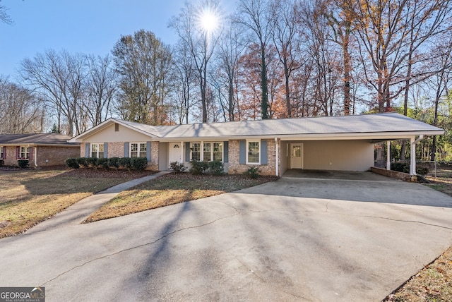 single story home featuring a front yard and a carport