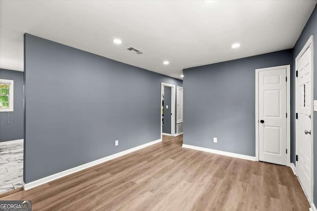 unfurnished bedroom with light hardwood / wood-style flooring