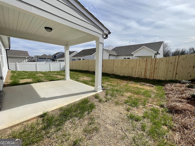 view of yard featuring a patio area and a fenced backyard