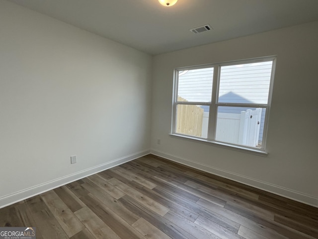 119 Savannah Way Unit C10, Milner, GA 30257 - spare room with baseboards and dark wood-type flooring