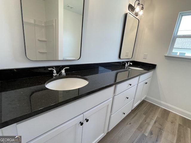 119 Savannah Way Unit C10, Milner, GA 30257 - full bath with wood finished floors, double vanity, and baseboards