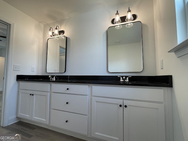 119 Savannah Way Unit C10, Milner, GA 30257 - bathroom featuring wood finished floors, double vanity, and baseboards