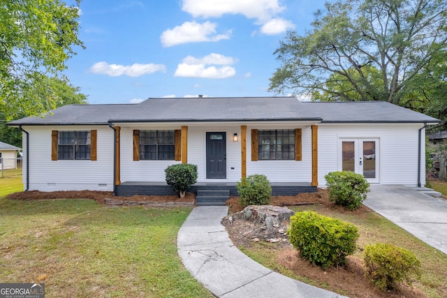 ranch-style house with a porch and a front lawn