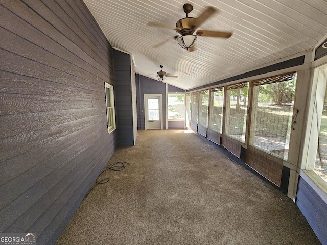 unfurnished sunroom featuring lofted ceiling