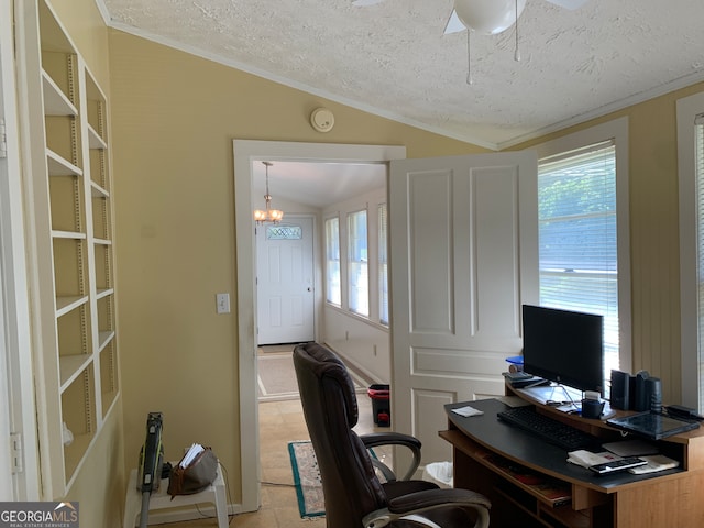 office space with a textured ceiling, ceiling fan with notable chandelier, vaulted ceiling, and a healthy amount of sunlight