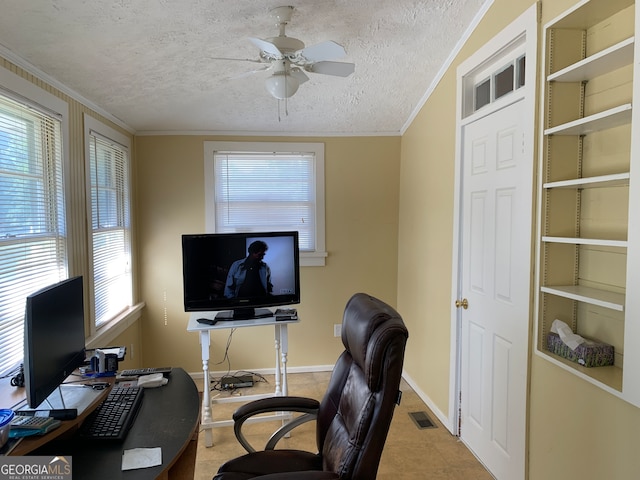 office area featuring ceiling fan, a textured ceiling, and ornamental molding