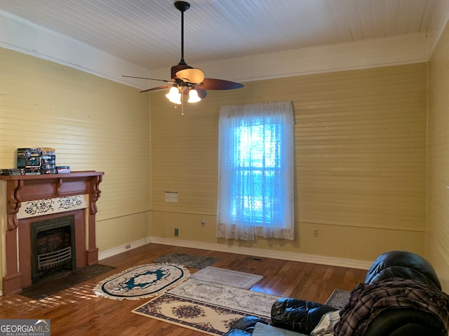 living room featuring dark hardwood / wood-style flooring and ceiling fan