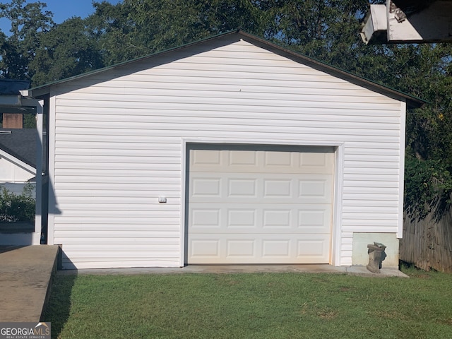 garage with a lawn