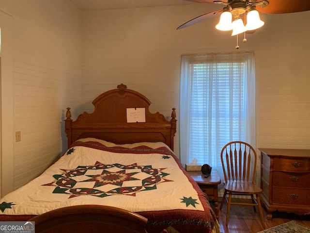 bedroom featuring ceiling fan and hardwood / wood-style flooring