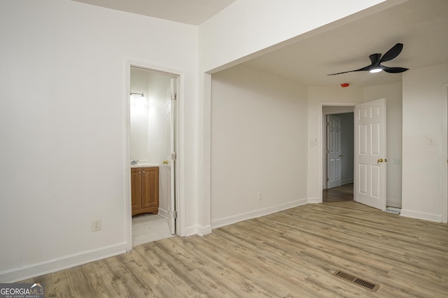 interior space featuring light wood-type flooring and ceiling fan